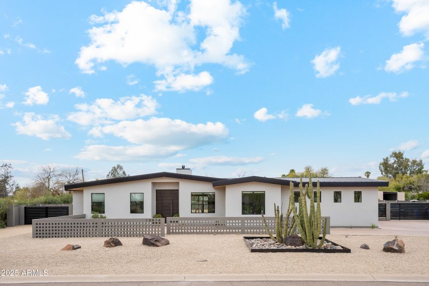 Move-in ready in Coveted Cactus Corridor! Unparalleled Modern Split Floor Plan Built in 2020 of almost 4,000sf & just re-finished into a brand-new home! Sitting on over 36,000sf lot in the highly desirable 85254 zip code in Scottsdale! This home is modern, light, bright, and highly functional with 2 Primary Bedrooms, and 3 kids bedrooms or office & 3.5 baths. The floor plan offers lifestyle & comfort and is ready to make it your own. Walk through and feel a home that provokes a sense of serenity, simplicity, and unequaled quality and beauty. A magnificent layout greets you in the living, dining, and kitchen as the main areas. Then span to the two Primary BR to the left. To the right, you'll find the office, kids' bedrooms, with also a spa-like bath and a generous family/playroom or stud for maximum functionality. Your clients will love this floor plan with finishes like Italian porcelain floors, Watermark by Rejuvenation faucets, all floating vanities with spa baths dressed in exquisite Italian tiles & finishes. The backyard is a blank canvas to design your own oasis to best fit your lifestyle. New front landscape and automatic watering system. The over 1,000sf RV garage is connected to the sewer, water, and electrical subpanel, and can easily be converted into a guest house, or gym!