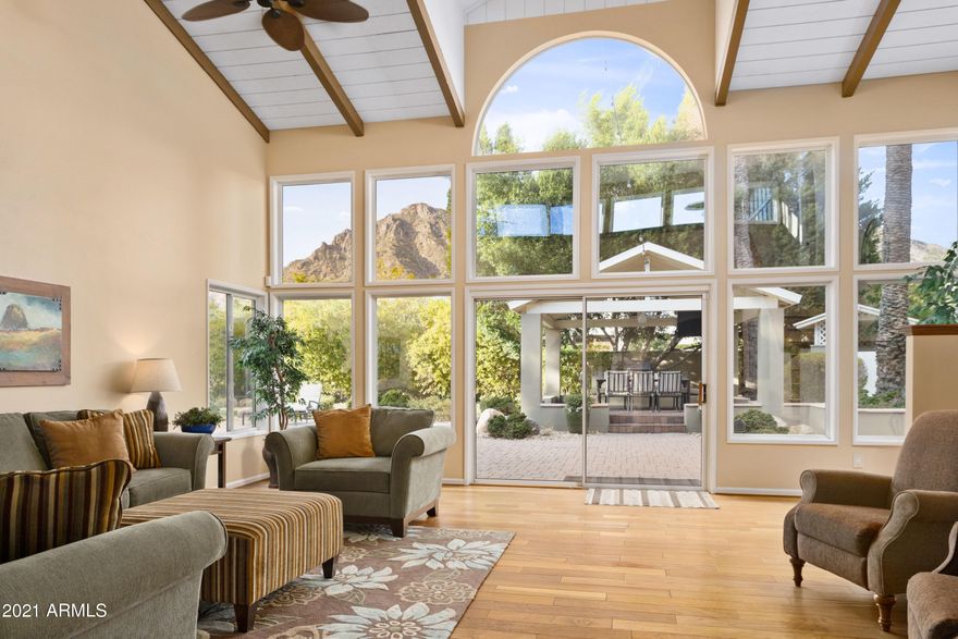 This very special gated estate within Arcadia has unobstructed views of Camelback Mountain! Ideally located just minutes from Fashion Square, Phoenician Resort, and all of the shops and restaurants the area offers, this home is an excellent opportunity for a car collector, complete with garage space for 12 -16 cars.  The home sits on well over an acre and features an attached casita, game room, home theater, fitness room, spacious owner's suite, and a resort style backyard complete with a heated pool. Very private with all of the architectural charm you'd come to expect in the area. This extraordinary property is waiting for you to make it your own.
