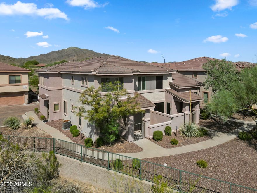 The Gavilan Vista: Elevated living in Anthem. This stunning 3-bed, 3-bath townhome offers secure, low-maintenance living in an exclusive gated community. The open-concept main level leads to a private patio with desert views. A desirable ground-floor bedroom and full bath offers flexibility. Upstairs, the primary suite features an upstairs laundry room. Enjoy the community pool just steps away, plus a 2-car garage. HOA Includes: Water, sewage, roof, blanket insurance, gate access, and all Anthem amenities (water parks, pools, tennis, basketball, pickleball, childcare, indoor/outdoor basketball, and trails). Perfectly located near Outlets and with easy I-17 access for an effortless commute. Anthem Vibes.