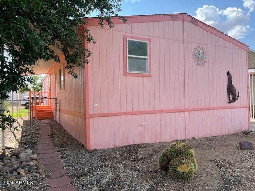 Cute home and great floorplan! Gather in the cool of the evening on the back porch or inside in the large open living room. This home has two bedrooms plus a den or office that could easily be used as another bedroom. Beautiful double pane windows. Comes with refrigerator and washer and dryer. Newer HVAC system that is 3 years old. Shed for storage. Covered carport for two or more vehicles. Fenced back yard. Needs floor covering throughout, a toilet in the master bathroom and a range in the kitchen. Home to be sold ''as is'' with no repairs. The price reflects the items needed.