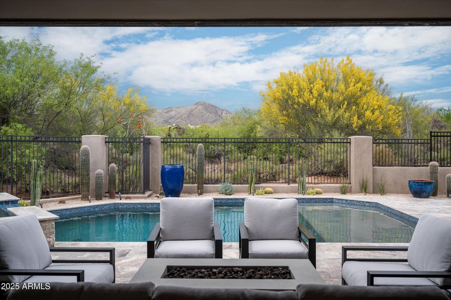 Welcome to your Desert Mountain sanctuary—a custom-built, single-level estate that seamlessly blends elegance with the relaxed charm of Sonoran Desert living. Ideally situated near both gates and the Sonoran Fitness & Spa, this thoughtfully designed home offers resort-style living in one of Arizona's most prestigious communities. Boasting five bedrooms, four of which are en-suite, and two additional bonus rooms, the flexible floor plan is ideal for personalized living—whether you desire a home office, creative studio, den, or music room. Throughout the home, wide plank oak flooring, custom lighting fixtures, and timeless finishes create a warm yet refined ambiance. The heart of the home is the spacious great room, highlighted by a striking granite fireplace surround and flowing seamlessly into the gourmet kitchen. Outfitted with chef's-choice appliances and ample workspace, the kitchen is designed to delight culinary enthusiasts and entertainers alike. Step outside to your own private resortwhere a brand new pool, spa, built-in BBQ station and fire-pit (completed in 2024) invite relaxation and outdoor gatherings. The high-ceiling covered patio offers a peaceful setting to take in panoramic views of Apache Peak, Lone Mountain, and the vibrant Sonoran landscape. Golf membership is available through The Desert Mountain Club; please note a 30-day application process and a waitlist may apply. With its prime location, exceptional craftsmanship, and breathtaking natural surroundings, this home is a rare opportunity to experience the best of Desert Mountain luxury.