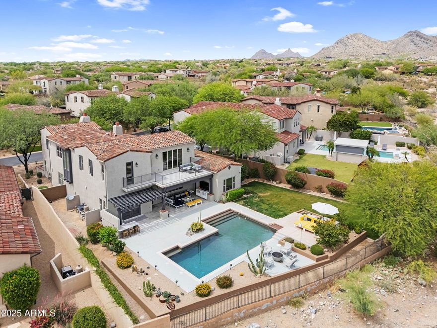 Exceptional value in The Haciendas at DC Ranch. This spacious residence offers mountain views, timeless architecture, and an expansive backyard retreat. While thoughtfully updated, the pricing reflects an opportunity for buyers to bring their own vision and updates, creating a home tailored to their lifestyle. Rarely does a property of this caliber and location become available at such a compelling value in one of Scottsdale's most desirable gated communities.The beautiful interior features a main-level guest or flex room, hardwood floors, and a gourmet chef's kitchen that impresses with quartzite countertops, Sub Zero refrigerator, double ovens, 6-burner gas stove, and an oversized island. The adjacent pantry and bar area with wine refrigerator connect seamlessly... to the formal dining room for effortless entertaining.

The luxurious, spacious main-level owner's suite is a true retreat, complete with a cozy sitting area and dramatic mountain views. Its spa-inspired bath offers a soaking tub, walk-in shower, dual vanities, and a generous walk-in closet.

Upstairs, enjoy a private suite with an attached bonus/media room, plus two additional guest bedrooms with a shared bath ideal for family and visitors alike.

Step outside to a private resort-style backyard that backs to protected natural open space ensuring uninterrupted views and complete privacy with no neighbors behind. Take in panoramic scenes of the McDowell Mountains and distant Camelback Mountain from the elevated viewing deck. The outdoor space is ideal for both quiet mornings and vibrant evenings, featuring a sparkling pool, multiple lounge areas, and lush landscaping a secluded sanctuary for relaxation and entertaining under the stars.

Located near paved walking paths connecting directly to Copper Ridge School and just minutes from DC Ranch's vibrant Market Street dining and shopping district, this home offers both convenience and prestige. Enjoy exclusive access to DC Ranch's community amenities, including private parks, pools, fitness centers, and miles of scenic trails.

This is luxury living, redefined for today's discerning buyer. Welcome home.
