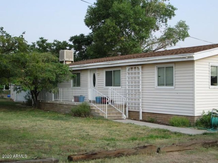Need a large home at the foot of the mountains with plenty of property, room to roam and amazing views?! THIS is the home for YOU!! There are 2 masters - one with handicapped accessibility. Check out the HUGE Walk-in pantry, Private well, fenced garden area, French doors from large family room onto back deck, 2-car garage with extra storage area & shelving, 2 hot water heaters, owned propane tank, chain link fencing with RV gate and MUCH more! ALL this is located on 1.05 acres! Call for a private tour today to see if THIS IS THE HOME FOR YOU!