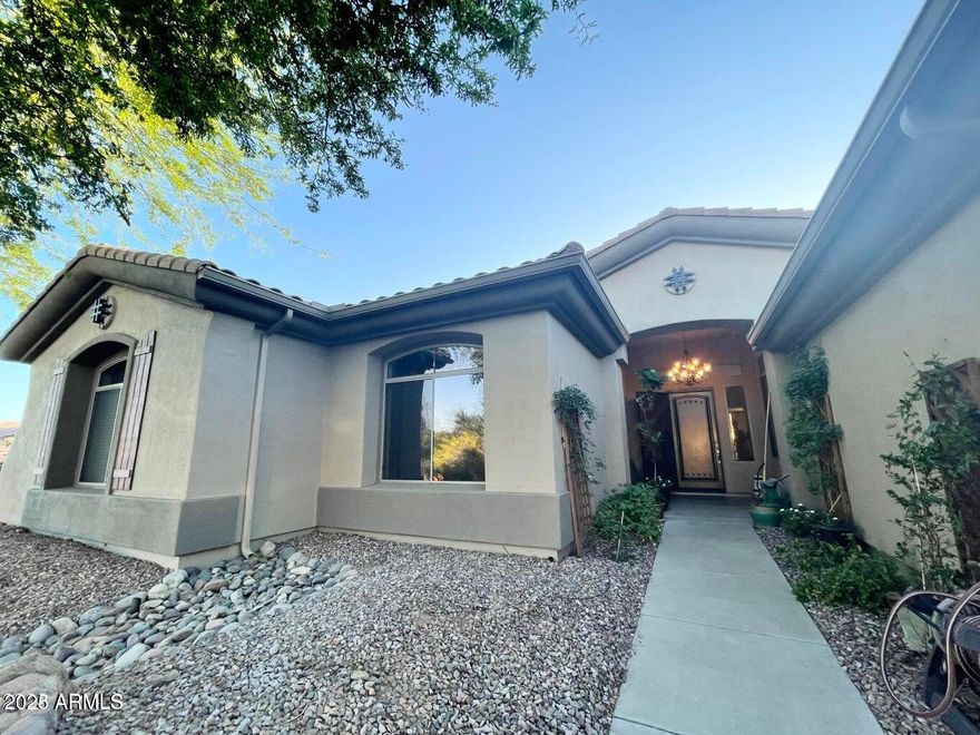 Nestled within Anthem Country Club, this stunning home offers elegance and comfort throughout. Granite shines in every space, including a dramatic lighted granite accent wall. Beautiful hardwood and ceramic flooring pair perfectly with elegant chandeliers that elevate the home's style. The split floor plan provides privacy, featuring a luxurious primary suite with a granite-enclosed shower. A huge second bedroom includes an en-suite bath, while additional bedrooms are generously sized. The kitchen boasts granite countertops and beautiful appliances, ideal for entertaining. Step into a true backyard oasis with a sparkling pool and spa, built-in BBQ, fireplace, and travertine in all the right places. Complete with a 3-car garage and an large laundry room, Owned Solar Panels!