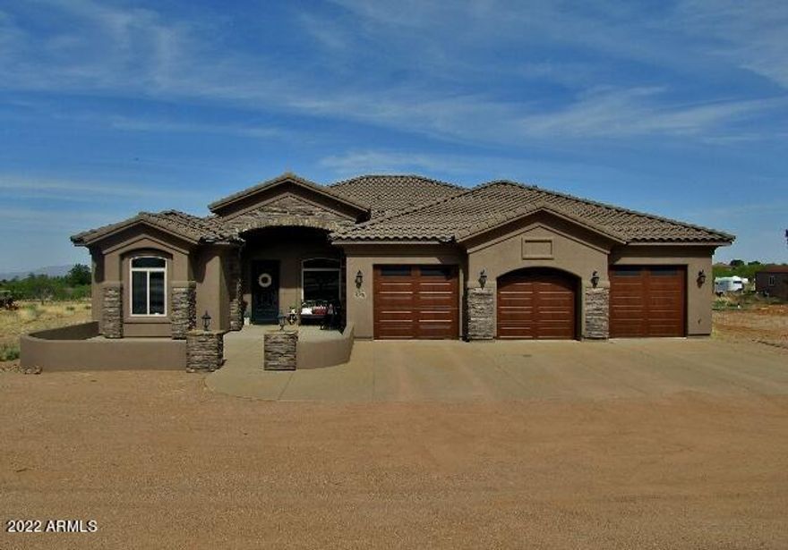 This gorgeous, custom 4BR/3.5BA/3CG, 3742 sq.ft. home on 2.29 acres in Sierra Vista, AZ is minutes from Fort Huachuca, shopping schools and Canyon Vista Medical Center.  The open split floor plan includes 3 living areas, a custom decoraticve 9-ft front door, a modern kitchen w/ large pantry and upgraded appliances, custom tile work throughout, custom ceiling fans, a large master bedroom with sitting area, a huge master en suite with walk-in snail shower w/ multiple shower heads and jetted tub, an extra large laundry room with tons of cabinet space and many other upgrades.  The exterior includes custom garage doors, front courtyard and beautiful views of the Huachuca Mountains.  Call today!
