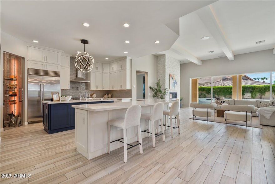The 2020 Energy Star Certified Semi Custom Award Winning Cachet home is stunning and ready to impress. Driftwood color porcelain through out, Snowdown white walls, Control 4 for a superior living experience. Full Pool Chiller for hot days in the Summer, with pool heater for chilly nights, natural gas operated. LED lighting package in Main living area and Primary Suite, 550 bottle wine cellar, Sub Zero and Wolf appliances, Inline ice maker, second refrigerator in laundry room with exceptional double island. All bedrooms have En-Suite Bathrooms,  Bonus room built out for quiet home office space. Attached Casita, and many more items to offer, including air conditioned garage and 200 AMP fast EV charger, 10 & 12 foot ceilings throughout. Last comparable sale 2.75M 5542 E Allan