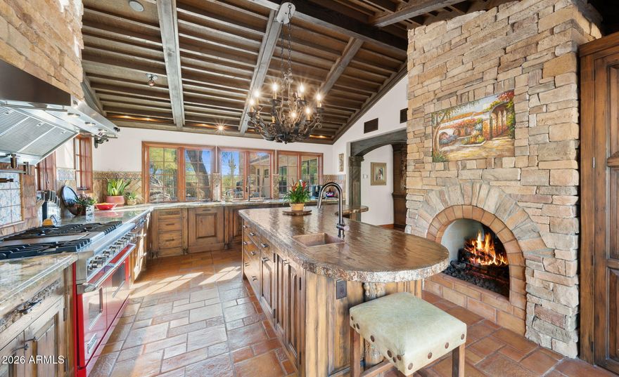 Discover the joy of owning a fully furnished, sophisticated Spanish-style hillside retreat offering breathtaking city lights and mountain views -- including the iconic ''Indian's Toe'' on Black Mountain. Designed for those who appreciate authenticity and craftsmanship, this home captures the true spirit of Arizona living with stone accents, wood-beamed ceilings, hand-carved architectural details, and timeless clawfoot bathtubs.

The chef's kitchen is both stunning and functional, featuring custom handmade cabinetry, a hand-carved petrified wood island with a copper prep sink, a cozy fireplace, and a 48'' Viking Range range. Entertain effortlessly in the game room with a full bar and dedicated wine storage.

Outdoor living is equally exceptional, with multiple patios, a fenced pool fram by natural boulder outcroppings and an outdoor shower, plus a rooftop deck perfect for sunsets and stargazing. This is desert luxury at its finest -- warm, refined, and move-in ready for today's discerning home buyer.

Located just 2 miles from the charming town of Carefree, 2.8 miles from the western town of Cave Creek, and 18 miles from Scottsdale & the 101 Loop/Pima Freeway.