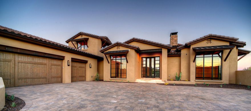 Enjoy luxury living with unequalled desert surroundings in the private golf community of Firerock Country Club. This rustic ranch contemporary home offers resort style living with incredible golf and city light views. Custom handcrafted cabinets, Wolf and SubZero appliances, hand selected book matched island granite top, hand chiseled Turkish stone floors, floor to ceiling windows, negative edge pool and oversized spa. Self pocketing 10 ft great room doors open up to expansive outdoor living. 1500 sqft of covered patio space entertain 360 degree views. All the best Scottsdale shopping and dining just 20 minutes away. Conveniently located within minutes of Mayo Clinic, Basis School and charming downtown Fountain Hills.