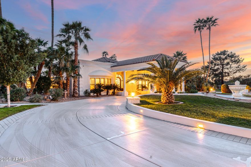 Discover the pinnacle of luxury in the gated enclave of The Estates at Scottsdale Ranch. Priced well under the recent appraised value, this 8,143 sq ft masterpiece rests on a prized 1.3-acre cul-de-sac lot. Offering four bedrooms plus office or three bedrooms with two offices, each served by seven baths, this residence exudes timeless elegance. Over 5,000 sq ft of Canterra stone, complemented by wood-like flooring, natural light, and an energy-efficient solar system, highlight modern sophistication. The resort-style backyard is an entertainer's dream with an oversized cabana featuring a BBQ, a mesmerizing pool and spa crowned by four waterfalls, and a striking catwalk to the spa's center. Impeccable craftsmanship and modern functionality define this estate, offering epitome of Scottsdale.