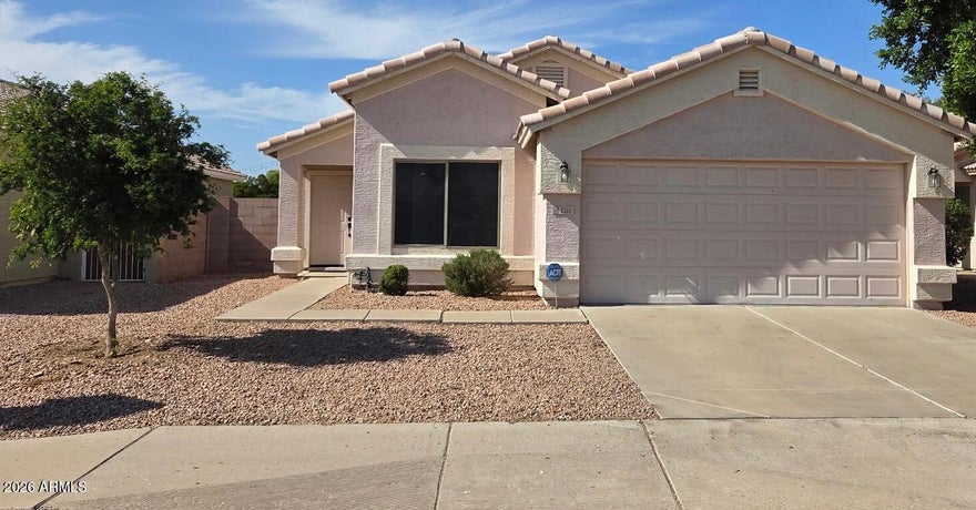 Beautiful 3 bedroom home two doors down from elementary school.  New paint, carpet, fixtures. New Blinds throughout.  Newer appliances.  Vaulted ceilings throughout.  Oversized backyard ready for landscaping. Vacant ready to move in!  Great location.