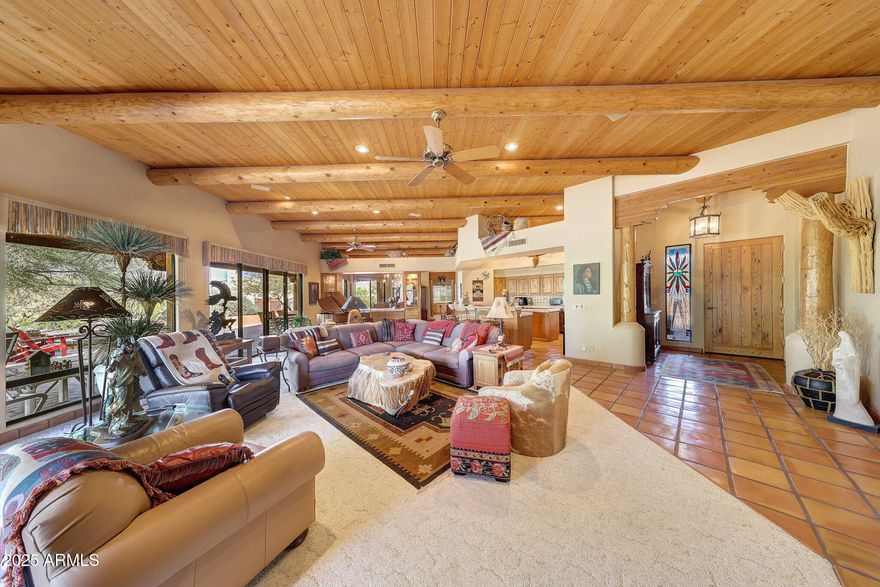 Ready to negotiate with the right buyer. Experience a one-of-a-kind Territorial home that embodies Southwest living. This 4-bedroom, 2.5-bath estate offers 3,321 sq ft of thoughtfully designed space, including a private primary suite separated from the guest wing for maximum privacy. The bright, open great room with 12' ceilings, flows effortlessly to the kitchen & dining area, making daily life & entertaining a breeze. Stunning tile work & artist touches celebrate Arizona's natural beauty across every room. Enjoy peaceful mornings & magical evenings from the observation deck, with uninterrupted sunrise-to-sunset desert views. Finishes throughout emphasize craftsmanship & character, creating a warm, inviting atmosphere. Discover the distinctive Southwest lifestyle this home has to offer.