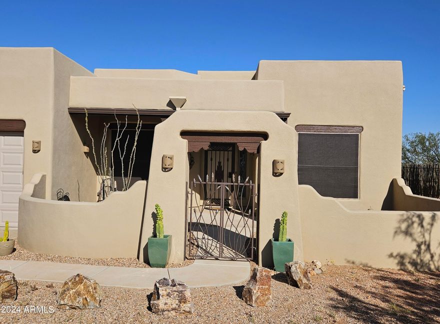 Exceptional Santa Fe Home with Horse Property on pavement with 7.26 acres. Completely fenced and cross fenced. Horse ready with nice flat pasture areas and Mesquite trees! Between the Huachuca Mountains and the San Pedro River. It really does not get any better!!! 3 bedroom, 2 bath with recently enclosed large screened in back patio. Many nice upgrades done within the last few years to include Granite countertops. Home has Saltillo Tile throughout. Detached workshop/Casita type unit.  Additional 7.27 Acres to the East (MLS#6768035) and Additional 16.01 Acres to the North (MLS# 6788047) are also available.