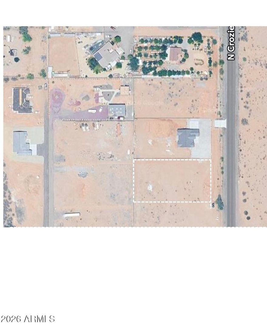 Fantastic price and prime location in Wittmann, AZ! This property presents an excellent opportunity for development with paved road access and nearby utilities. A block wall is already in place along the west perimeter, adding value and privacy. Enjoy stunning mountain views, creating the perfect setting to build your custom home or invest in a growing area. APS transformers are located on the corner for added convenience. No HOA per owner and CCRs. Deed restrictions require a minimum 2,600 sq ft home. Don't miss out on this great opportunity!