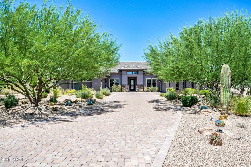 Stunning Luxury Home in Gated Andaluza Community - North Scottsdale
Located in the prestigious gated community of Andaluza in far North Scottsdale, this exceptional residence offers luxury living at its finest. Nestled at the end of a private cul-de-sac, this 4-bedroom, 4.5-bathroom home includes a spacious 600 sq. ft. attached casita—ideal for guests or multi-generational living.
The heart of the home is a chef's dream kitchen, thoughtfully designed with dual islands, a generous walk-in pantry, a prep kitchen, and a dedicated wine room. The open-concept great room seamlessly connects to a formal dining space, creating an elegant environment for entertaining. Step outside to your private resort-style backyard, featuring a large heated oasis pool, spa, putting green, and an expansive outdoor kitchen beneath a custom-designed pergola. Enjoy sweeping desert views of Black Mountain from your tranquil outdoor retreat.
Situated adjacent to the charming communities of Carefree and Cave Creek, you'll have convenient access to world-class golf, hiking, dining, fishing, and boating. This extraordinary property blends luxurious indoor comfort with the ultimate Arizona outdoor lifestyle.