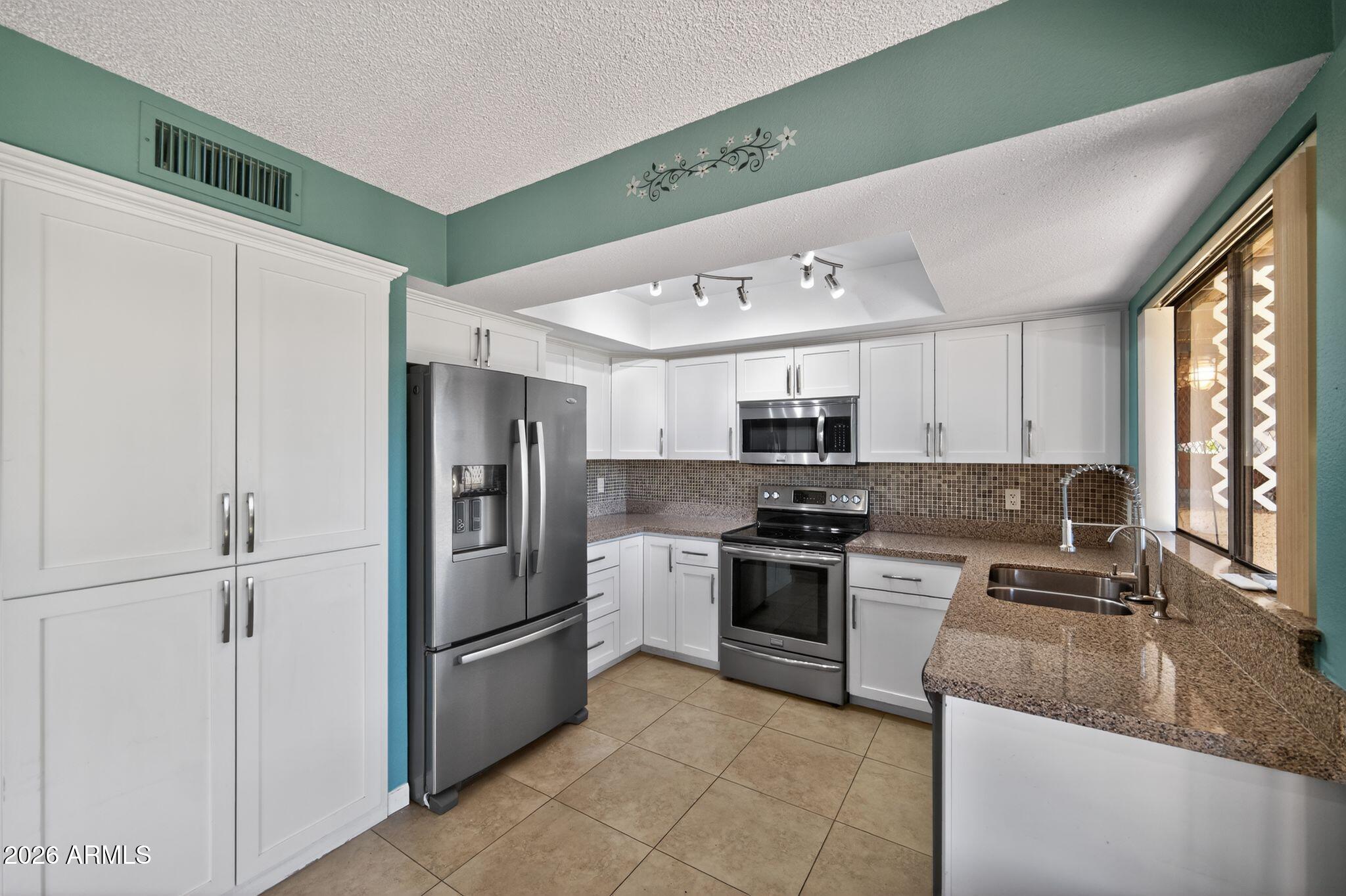 7711 E DESERT FLOWER Avenue