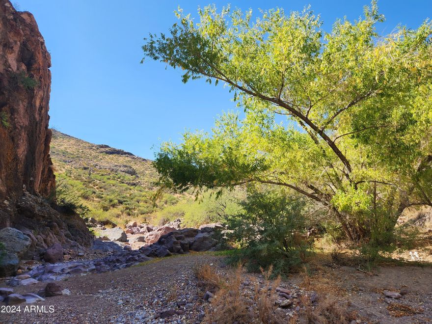 SEEKING the ULTIMATE PRIVATE GETAWAY-HIDEAWAY. SECLUDED yet a mile from Historic CASTLE HOT SPRINGS RESORT. Famous GOVERNORS PEAK & SALVATION PEAK and the beauty of  LAKE PLEASANT all close by. Majestic Rock Formations, Natural Springs, Hunting, Fishing and more close by. Perfect place to unplug and leave it all behind! Bordered on two sides by 11,604-acre HELLS CANYON WILDERNESS AREA and beautifully rugged private land with  boulder strewn washes. Creating the perfect ''Leave me alone zone''.  Elevation ranges from 2300 ft. to 3000 ft providing spectacular views for miles. Build your ''Hidden Hunting'' cabin and bug out! Clean, Cool desert air awaits plus a long history of GOLD mining in the area. 
UPDATE: LEGAL ACCESS COMING SOON!! Working on this for A YEAR!!