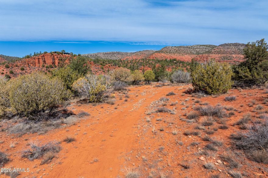Where the red rocks meet the water's edge. Nestled along the banks of legendary Oak Creek, this rare 7.5-acre parcel on Silent Owl Road offers one of Sedona's most coveted combinations: private creek frontage, sweeping red rock and mountain views, and over seven acres of untouched high desert landscape -- all with no HOA. Wander through native trees and natural desert vegetation across a diverse terrain of level ground, gentle slopes, and elevated plateaus that frame the surrounding scenery like a living painting. Accessible via scenic forest service and dirt roads, this is a place apart -- a true refuge where the silence is broken only by the sound of Oak Creek. Whether you envision a legacy estate, a private retreat, or a forever home rooted in nature, this extraordinary raw land parcel is your blank canvas in the heart of one of Arizona's most beloved landscapes. Opportunities like this are extraordinarily rare -- come see why.