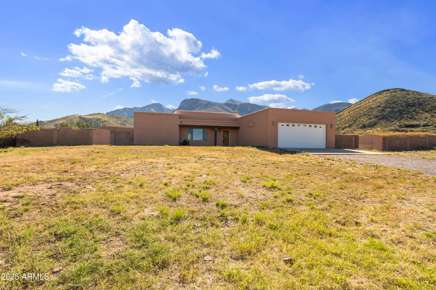 No HOA! Home is Remodeled, Beautiful Country Living!!! Enjoy this gorgeous 4 BDRM, 2 BATH,  2.5 car garage home w/ 0.83 acre block fenced back yard & waterfall views!!! Open floor plan w/a large kitchen & lots of storage. 4 large bedrooms, primary bath has step-in shower, guest bath with large garden tub.  Gorgeous tile floors and vinyl plank floors through out!!  Many ceiling fans.  oversized 2.5 car garage can accommodate your full-size truck and all of the tools. Freshly painted inside & outside. RV parking is available in the secured block fenced back yard.  Enjoy breath-taking mountain views from the covered patio!!! Frige, washer & dryer stay (As-Is). ON PAVED ROAD. Horses OK. Easy access, home is in turn-key condition!!!  Make sure home is secured, lights off when leaving.