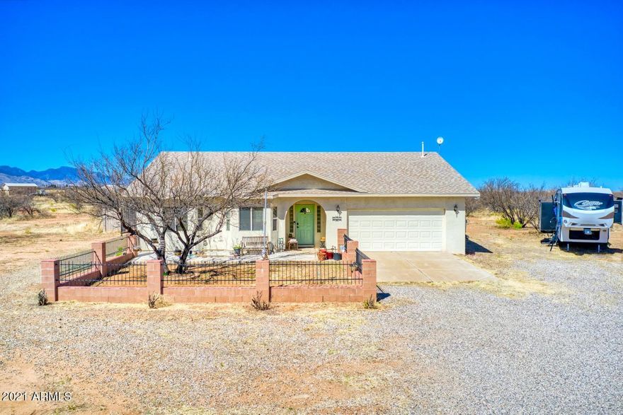 Here's a rare opportunity to own a Nice home with 4 bedrooms, 2 bath, a private pool and 4 acres of land.  This home has a split floor plan, 2 car garage and an upgraded kitchen with double oven, wine fridge and pantry with a sliding barn door. 
To the right of the house you'll see a well built storage shed ideal for your hobbies.
The property is partially fenced to enjoy southern AZ sunrises and sunsets from your very own swimming pool and Jacuzzi.  Schedule your appointment to see this property at your earliest convenience.