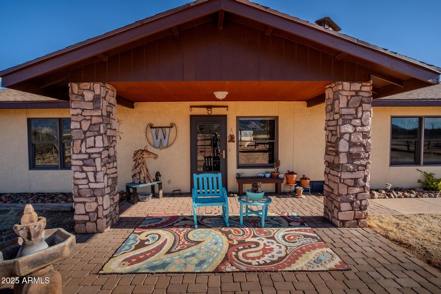 Horses Welcome! This 17-acre property includes a 3-bedroom western styled ranch home with brand new roof and gorgeous back yard with solar heated in-ground pebble tec pool complete with waterfall feature, and outdoor fireplace with bench seating, barn with 9 horse stalls, riding arena with additional turn out, separately fenced pasture, private well with manual hand pump, two bay lean-to structure, and the list goes on!  You'll love the mountain views with breath taking Arizona sunrises and sunsets. This listing is for both parcels 104-82-026B (4 acres) and 104-82-026K (13.34 acres).  You won't find one like it.