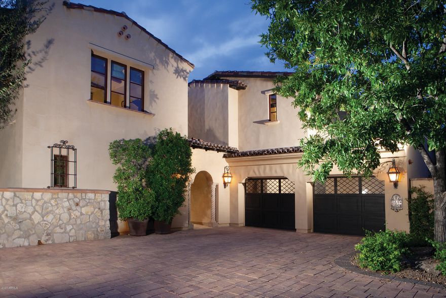 This gorgeous and highly upgraded turn key villa, part of the world renowned Omni Resort and Spa at Montelucia, is the ultimate in low maintenance and luxury resort living. This stunning Spanish style residence is one of 34 Villas that are privately guard gated. Villa owners receive resort privileges with access to five restaurants including critically acclaimed Prado Restaurant, award winning Joya Spa, pools, valet, room service, concierge and more. This 3 bedroom, 3.5 bath Villa features 4,268 sq. ft of living space, a Viking stainless steel chef's kitchen, butlers pantry with wet bar, intimate formal dining room, a private elevator that takes you to the master suite, a casita with separate guest entry, heated spa and so much more .