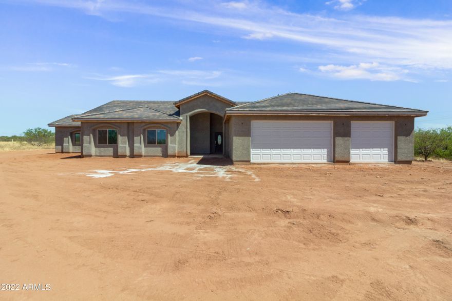 Gorgeous custom built new construction home. You have to see what all this house has to offer. Sitting on over 3 acres with amazing views. Step inside the 3 bedroom and 2 bathroom home with the open concept living, dining and kitchen space. This floorplan also gives you a separate GREAT ROOM - use it for family room, game room, theater - the options are endless. Tile floors throughout the living areas and carpet in the bedrooms. Spacious laundry room inside. 3 garage space allows for all the covered and protected parking and storage you need. Get into a NEW NEW home today.