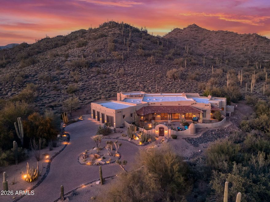 Truly one-of-a-kind! 4,184 sq ft Main Residence Plus 512  sq ft. Detached Casita showcase classic Old World architecture paired with modern comfort. This extraordinary Spanish Estate delivers exceptional Privacy and Peaceful Desert Elegance! Perfectly nestled against the Mountain Preserve on a Premium 1.92-Acre cul-de-sac lot in prestigious Canyon Ridge Estates!
Wake up to breathtaking Black Mountain views and end each day with unforgettable Arizona sunsets. This timeless Estate blends authentic Craftsmanship with refined, Functional Luxury, a Rare Turnkey Opportunity in the heart of Cave Creek! A pavered circular drive leads to a private courtyard surrounded by mature desert landscaping and a warm, inviting outdoor fireplace. Inside, exposed wood beam vigas, custom alder cabinetry, Forest Granite, and handcrafted tile details create rich character. The Chef's kitchen is designed to impress with Wolf, Sub-Zero, and Fisher & Paykel appliances, oversized island, café dining, and breakfast bar - ideal for entertaining! The Owner's Retreat is pure serenity, featuring a fireplace, sitting area, and stunning custom barrel ceiling. Three additional ensuite guest rooms offer comfort and privacy, while the detached casita provides flexible luxury living with fireplace, kitchenette, living area, walk-in closet, and custom bath. Step outside to your private resort sanctuary backing to saguaro-dotted mountains, fruit trees, beautiful landscapes. Enjoy a heated negative-edge saltwater pool and spa, multiple lounge areas, dual fireplaces, built-in BBQ, pool bath, and spiral staircase leading to a rooftop deck capturing glowing crimson sunsets and sparkling city lights! This is not just a home -- it is an elevated desert lifestyle!