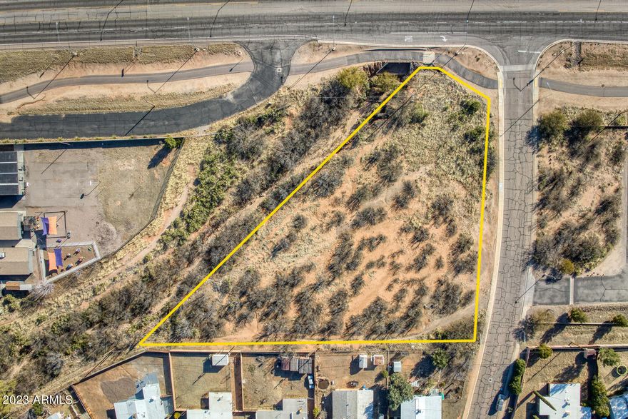 Come check out this corner lot with Highway 90 Frontage that offers GREAT VISIBILITY for your new Office bldg, Restaurant, Medical Office, or other commercial bldg. ADOT reports OVER 15,500 VEHICLES drive by DAILY. This location is a stones throw from 2 major shopping centers that feature multiple national restaurant chains, grocery, department, and specialty stores. It is also minutes from the Canyon Vista Medical Center. Due to this, it would be an excellent location for a medical office. Travel five minutes south and you are at Cochise College and the U of A South campus. There are so many possibilities for this 1.2 acre lot. Own it for yourself or as an investment for the future.