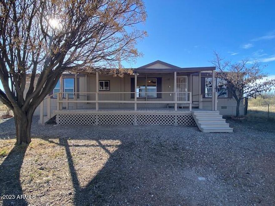 Freshly painted home 1700+sq.ft. 3 Bedroom 2 Bath split floor plan large kitchen on  4 acres Enjoy panoramic mountain view from ex large front covered porch.