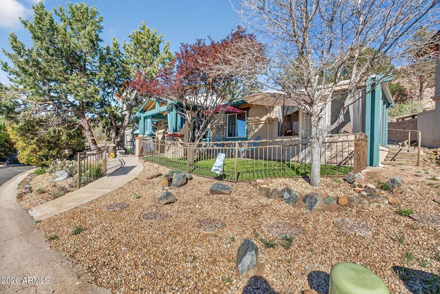 Imagine waking up to the views of Thumb Butte through your kitchen window, brewing a hot cup of coffee, and then sitting out front under your covered deck enjoying the views from high above the Prescott Town Square.  That's what you'd have if you owned this move-in-ready two-bedroom, one bath home in the serene setting of Manzanita Village, a unique cohousing community located within walking distance to the Prescott Town Square.
Just up the street you'd have access to the Community Park, Clubhouse and Community Garden.  Inside the Clubhouse you could enjoy a variety of amenities including TV Room, Fireplace, Workout Equipment, Showers, and a Large Community Dining Hall with Community Dinner every Thursday evening.
Unique features radiant floor heating, a whole house ventilation system an whole house mini-split air conditioning system, Solatube Natural Lighting, Fire Suppression Sprinklers and a Centerpiece Gas Fireplace that completes your enjoyable living space.