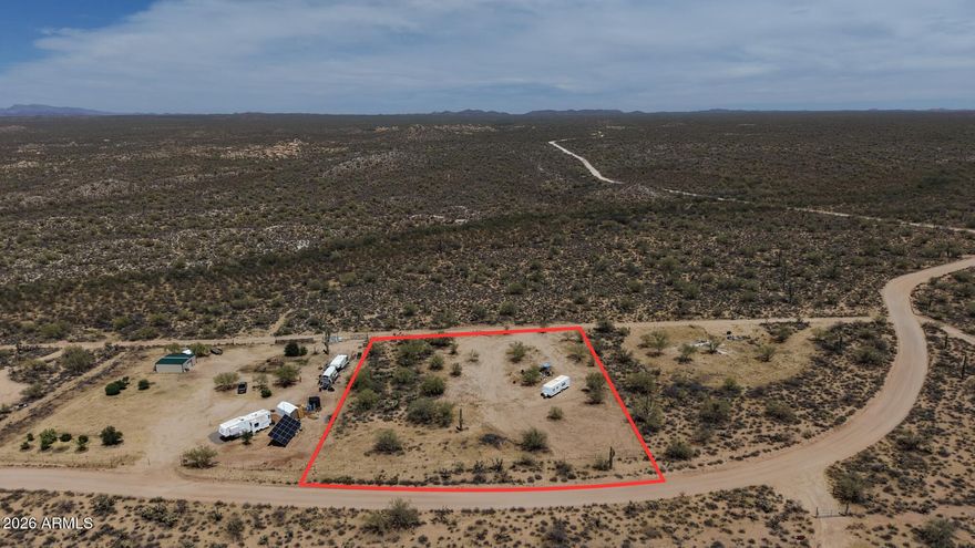 1.64 acres of flat, beautiful Arizona desert land ready for your dream home, mini-ranch, or weekend getaway. A shared well is already installed, giving you a great head start -- buyer will need to install septic. Enjoy wide-open space away from the hustle, bustle, and traffic of town with room for horses, animals, toys, hobbies, gardens, or a peaceful homestead setup.

Bring your vision and make this desert property your own!

All facts, figures, utilities, zoning, well information, and measurements are buyer's due diligence.