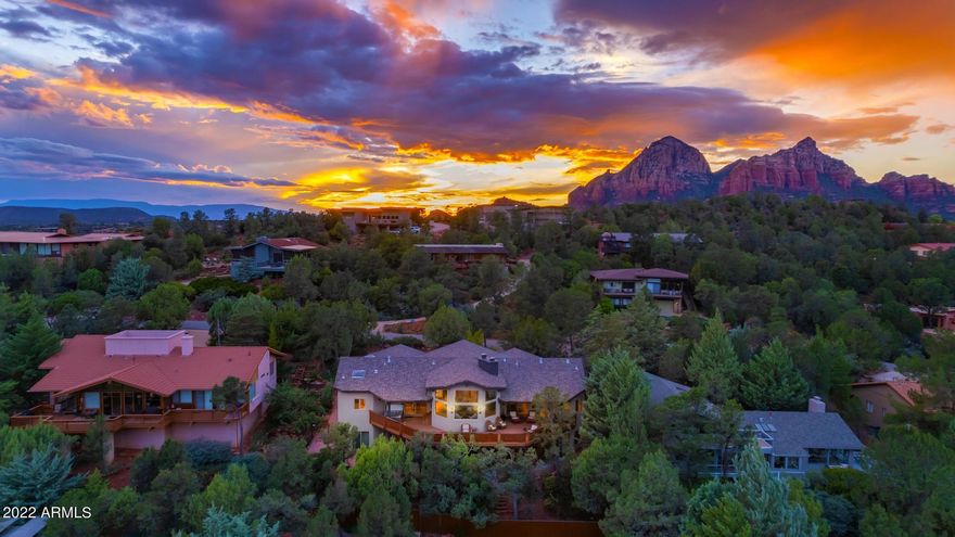 We invite you to come and explore this luxury home in uptown Sedona. Close to shopping, world-class hiking, and creeks that run year-round.  Enjoy Panoramic red rock views while having dinner, enjoying the open living space, and right from your primary suite.  Walk out on the extended deck and be inspired by the scenic sunrises and sunsets. Interior designer Stephanie Larson, ''Sedona's Best Of Best'' 10 years running, currated this home with excellence.  Large gourmet kitchen, 10-foot Island. Dacor Appliances. Solid Cherry cabinetry and Taj Mahal quartzite throughout. Farmhouse stone sink and Italian faucets. Perfect for entertaining and a quiet getaway. Hubberton Forge hand-crafted lighting inside and out. Hand-cut stone fireplaces up and down. (Continued)... Double-sided upstairs. Hunter Douglas motorized shades throughout. Custom office builtins. Custom furnishings can be sold separately for  $100,000 Nathan Anthony and American Leather furniture. Furniture does not include a small office downstairs Desk, Couch, and Long table downstairs in the hallway. Shuffleboard, Foosball and Pool Table, entire home SONOS sound and TVs included). Upgraded HVAC. Entire home water softener. Never rented but projected $350,000 yearly rental potential. Comfortably sleeps 14. Turnkey! Close today. Move-in / rent tomorrow. Great location.
