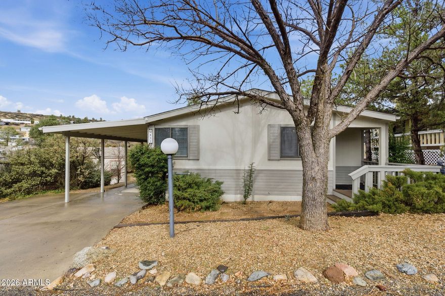 Amazing Prescott Canyon location just 5 minutes to shopping, dining, and downtown amenities. Extensively updated and move-in ready with new quartz countertops, new appliances, new flooring, new roof (2024), new cooling system (Aug 2025), new sewer line (2025), and new 2'' blinds (2026). Open floor plan with cozy wood-burning fireplace and abundant natural light. Spacious primary suite with walk-in closet. Flexible third bedroom ideal for den or home office overlooking mature trees and seasonal creek bed. HOA includes trash service plus access to community center, indoor pool, fitness facility, tennis and pickleball courts. Low-maintenance, resort-style living in a highly convenient Prescott location.