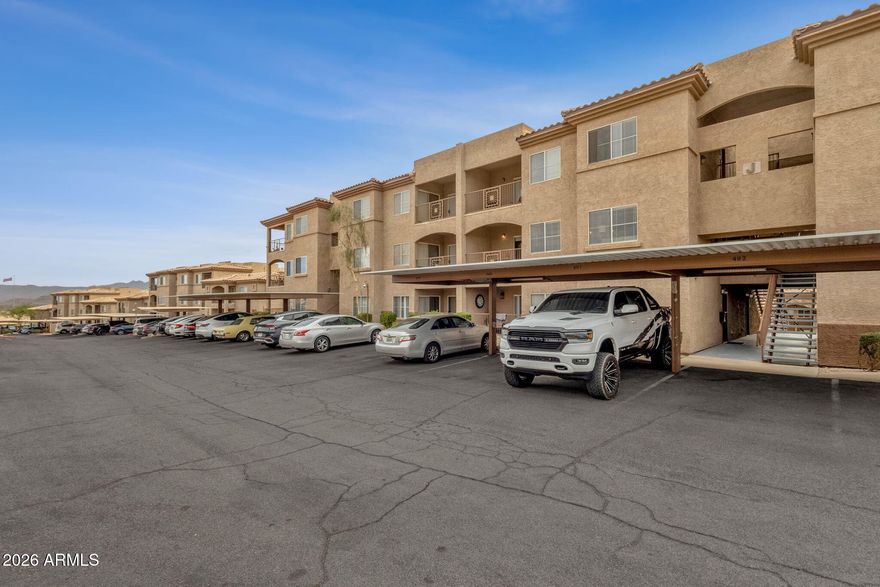 Step into easy desert living in this updated 1-bedroom, 1-bath condo with 778 square feet located in the sought-after Four Peaks community of Fountain Hills. With a private exterior entrance and a smart, efficient layout, this residence delivers comfort and functionality in a low-maintenance setting.

Inside, wood-look flooring and soft neutral finishes create a light, open atmosphere. The main living area flows seamlessly into the kitchen and dining space. The kitchen is appointed with white cabinetry, dark countertops, stainless steel appliances, modern fixtures, and a convenient breakfast bar for casual seating. Large windows and sliding glass doors invite in natural light and lead to a covered balcony. The spacious bedroom features plush carpeting, a ceiling fan, and ample closet space, while the bathroom showcases clean lines and contemporary finishes. A stacked washer and dryer are conveniently located inside the unit, along with additional storage. Carport or attached-garage parking adds practicality and convenience.

Four Peaks residents enjoy access to resort-inspired amenities, including an outdoor pool, spa and hot tub, steam room and sauna, fitness center, theater room, business center, BBQ grilling stations, and meticulously maintained landscaping throughout the pet-friendly community.

Situated in an International Dark Sky Community, Fountain Hills is celebrated for its striking desert scenery and brilliant night skies. With quick access to the 101 and 87, commuting across Maricopa County is convenient, and downtown Fountain Hills is just minutes away. This condo presents a fantastic opportunity to enjoy relaxed Arizona living in a prime location.