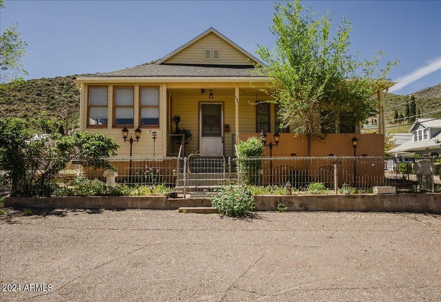 This one is a rarity in Bisbee! This restored and remodeled 1901 home perched tall on the hill has parking in front of home,does not require stairs to access, includes a garage, has a new roof and beautiful views of B Hill! The home offers 2 bedrooms and 1 bathroom with a skylight, high ceilings, restored original wood floors, fabulous butler's pantry in an adorable kitchen,  enclosed porch to enjoy all seasons and a spacious laundry room area. This one is a true gem that shows pride of ownership! Property is closely located to a park(.2 miles away) and the Bisbee swimming pool.