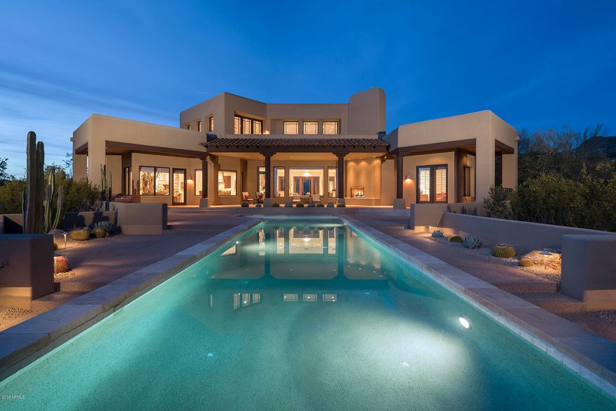 Remarkable price adjustment in The Country Club of DC Ranch.  Lot alone worth $2M. Surrounded by the 17th & 18th holes, picking up views of city lights and sweeping vistas of the valley below to the south, the location is an A+.The views enhance this custom estate home as well as the simple and clean lines of the architectural style. The timeless interior finishes are a welcome backdrop for transitional, contemporary or traditional furnishings.The home is primarily single story, with four bedrooms and casita on the main level and bonus room on the second story.Whether you are enjoying the charming front courtyard or the large lap pool in the generous outdoor living area, this home flows seamlessly and is perfect for entertaining large groups or intimate family gatherings.