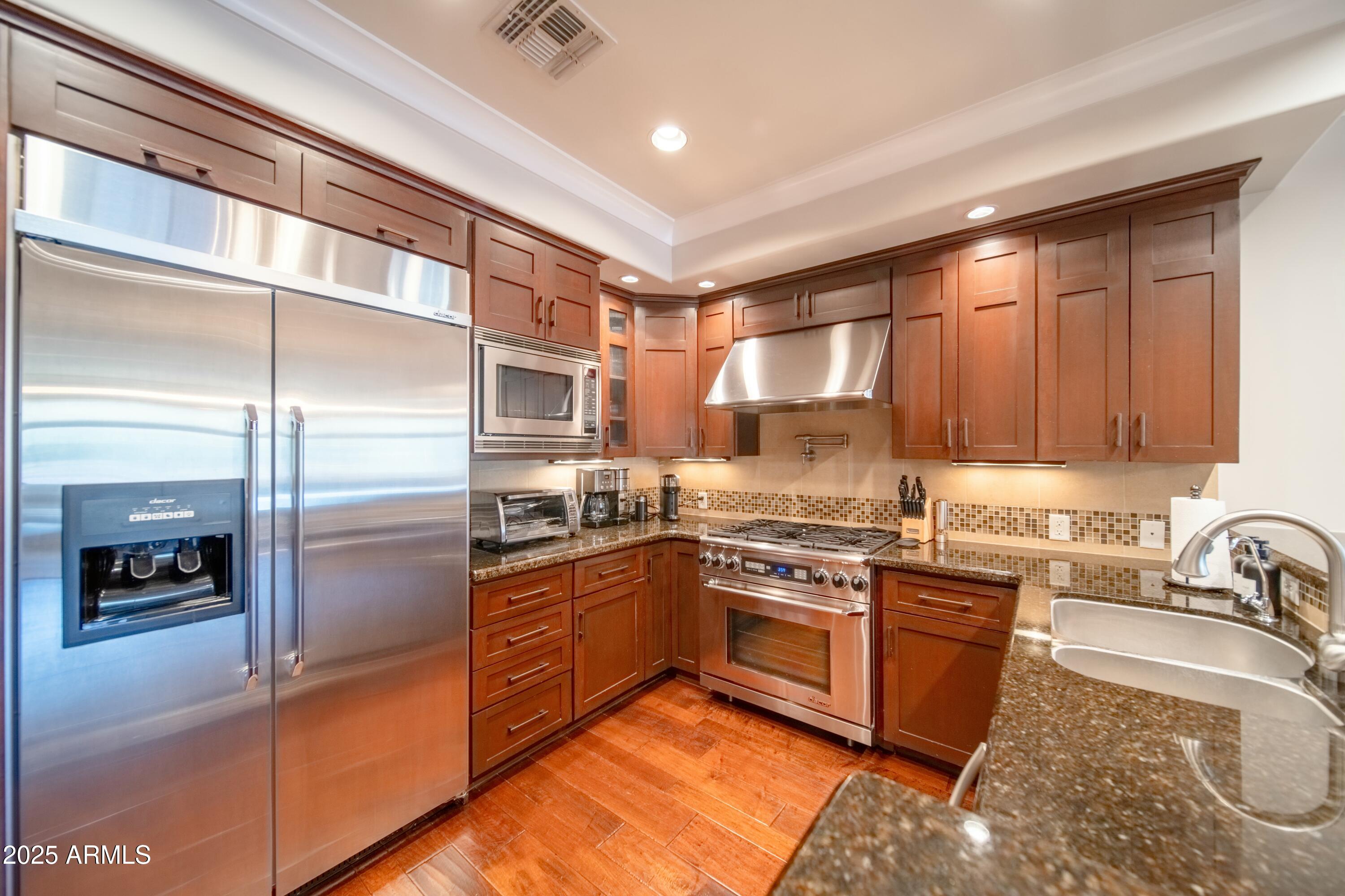 4909 N WOODMERE FAIRWAY -- 2003
