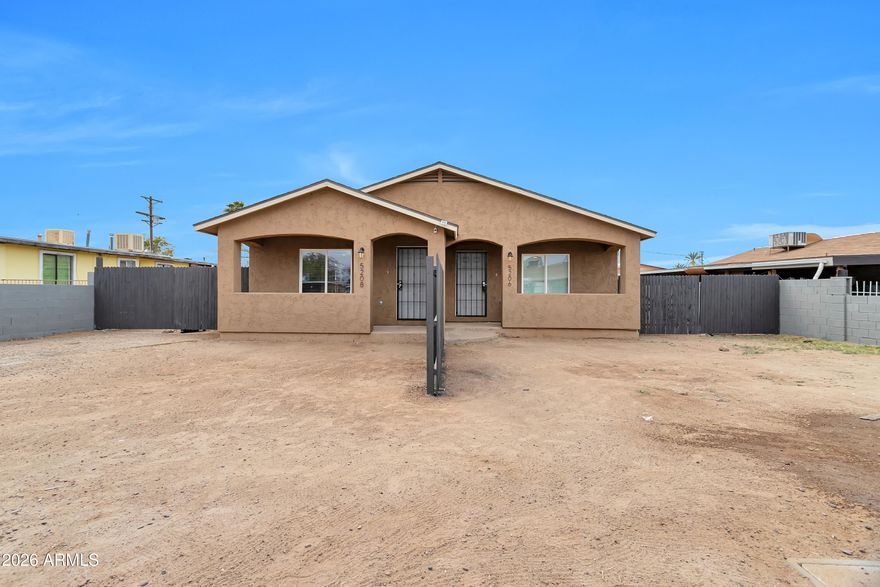 Welcome to an outstanding investment opportunity in desirable South Phoenix! This beautifully renovated duplex offers the perfect blend of strong cash flow, modern finishes, and strategic location--plus the flexibility to build equity while living rent-free. With two identical side-by-side units currently generating $3,520 in gross monthly rent, this turnkey property delivers immediate returns with minimal landlord involvement, or pursue a smart owner-occupancy strategy by living in one unit while rental income from the other covers your mortgage. Each spacious 2-bed, 1-bath unit features elegant, high-quality finishes throughout with updated kitchens showcasing white Shaker cabinetry, granite countertops, stainless steel appliances, and recessed lighting that creates a bright, modern aesthetic. Full bathrooms impress with new tiled showers, updated vanities, and contemporary fixtures. Open-concept living areas flow seamlessly, complemented by abundant natural light and new dual-pane windows that let in Arizona's beautiful weather year-round. This property is essentially brand new inside and out with a brand-new roof, new HVAC systems, and freshly updated plumbing and electrical throughout--completed in 2019-2021. The combination of structural integrity and modern efficiency means minimal maintenance concerns for years to come. Each unit boasts private front and backyards--a rare find in the duplex market. The huge fenced back area with convenient gates offers ample space for RV or boat storage, entertaining, or simply enjoying Arizona's stunning sunsets. Separately metered electric and water (yes for water as well) for each unit mean transparent billing and simplified tenant management, while low-maintenance front landscaping keeps curb appeal high without the headache. Current leases expire 12/31/2026 and 11/30/2026, providing excellent timing to implement your desired strategy--whether that's maintaining strong investor cash flow or transitioning to owner-occupancy with flexible rental options. Just minutes from Sky Harbor International Airport and downtown Phoenix, this neighborhood offers unbeatable convenience and is experiencing significant growth with new construction and exciting development projects nearby, positioning this as a strong value play. This is true turnkey real estate--fully occupied, fully renovated, fully metered with an attractive cap rate and low vacancy risk. Property is strictly drive-by; please do not disturb tenants. Walkthroughs available after contract acceptance. Don't miss this rare opportunity to acquire a premium duplex investment with immediate cash flow, modern finishes, location advantages, and the flexibility to customize your ownership strategy. Buyer to verify all facts and figures.