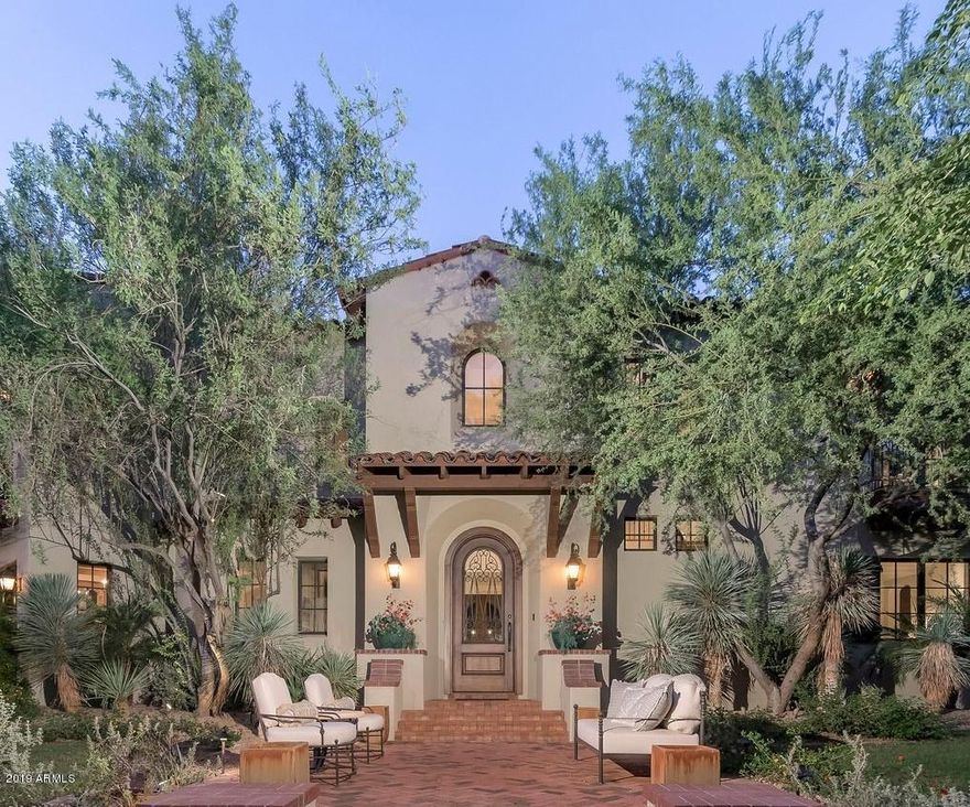 Arcadia at Silverleaf.  Authentic and charming, this magnificent Spanish Monterey custom estate is located on a premium corner lot overlooking one of Arcadia's signature parks and is the result of the superb craftsmanship of builder John Schultz of Schultz Development, and architect Mark Candelaria of Candelaria Design. This 8,174 sq. ft. home features 4 bedrooms, 4 bathrooms and 2 powder rooms with traditional Spanish influences and quality finishes throughout. Simply elegant and understated finishes include handmade tiles, stone and wood floors, beam ceilings, limestone fireplace surrounds and custom cabinetry.  This home is an entertainer's dream featuring a gourmet kitchen, custom bar, game room/media room and separate guest quarters. Outdoor entertaining is easy with numerous covered patio areas, charming fountains, large grass area, built in barbecue and sparkling spa and lap pool.