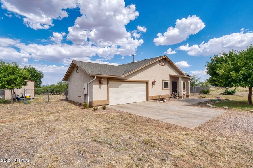 What a terrific home!  4 bedroom 2 baths, with all hard service flooring, on almost an acre of prroperty.  This home offers 2 covered patios to enjoy the beautiful views, and fully fenced for all your ''critters''.  This home has a ton of potential with an enourmous oversized Master Bedroom and remaining 3 bedrooms are good size.  Call today to possibly see your future home!