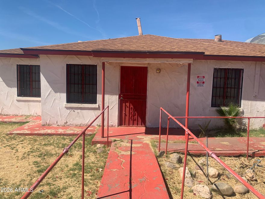 This listing encompasses parcels 115-42-058, 115-42-056, and 115-42-057-B, as outlined in red in the photos. Square footage and lot square footage in this listing represents the sum of the structures and area of those 3 parcels. This property contains a main house with 3 bedrooms and 1 bathroom, an attached ''church'' with 1.5 bathrooms, and a detached ''guest house'' with 1 bathroom and 1 bedroom, as well as out structures such as sheds. Approximately 55ft of frontage on Buckeye Rd. Current zoning of I-2.