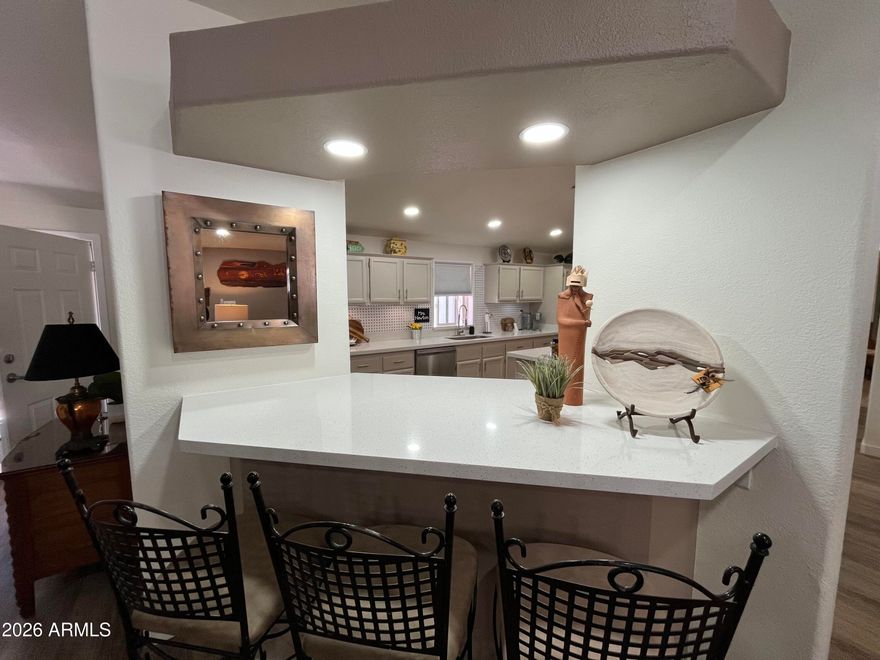 Experience this Impeccable Tastefully updated home! With a beautiful fireplace feature that will captivate the tranquil living experience! Features 21 recessed lighting fixtures,New Paint,New Flooring, 5 remote control lighted ceiling fans, new quartz counter tops with tile backsplash, stainless steel appliances, 2 patios, beautiful fixtures throughout the home. New ''Top Down Bottom Up'' window coverings and roof updated in 2023 & HVAC were installed August 2024! Come see this Gorgeous Home! Located in the 55+ Community of Rose Garden!