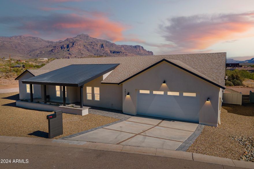 Welcome to Montana Dorada, the best kept secret in Gold Canyon Arizona. This single level new build home is part of an exclusive Modern Farm Desert Collection. Offering paved roads, quick access to the US 60, close to shopping and dining, complete with breathtaking views of the iconic Superstition Mountains at every turn. Offering 2989 livable SF, 4 bedrooms, 3 bathrooms, a large kitchen island, beverage bar, & butler's pantry. This split floorplan offers a large owners suite and guest ensuite both with private access to the large, covered backyard patio. All tile throughout with light earthy tones, and soft natural accents inspired by the Arizona desert, and designed to complement every style. This home comes with an oversized 2 car garage complete with epoxy floor and so much charm.