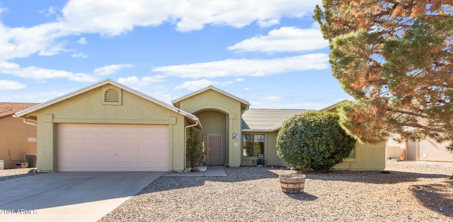 Welcome home! With so much square footage, you can enjoy multiple spacious living areas. The dining room is open to the kitchen and boasts a vintage chandelier. There is a second living room with a breakfast bar, that may be used for dining. There are so many options! The carpets are NEW in three of the four bedrooms. The oversized master bedroom has a large closet in the room, and there is another walk-in closet in the bathroom suite. Treat yourself to a spa day with the oversized bathtub! The backyard is prepared for you to garden, with garden beds and trellises already installed. The covered patio will keep you cool in the shade so you can enjoy the outdoor spaces. Come see this wonderful house, that you can make your home today!
