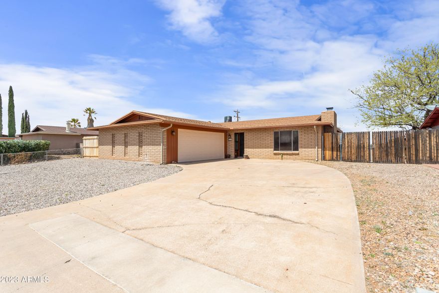 Gorgeous house in the desired subdivision. 3 bedrooms and 2 remodeled bathrooms. Tile through-out. Rock fireplace in the living room makes for a great cozy space. Kitchen opens nicely to eat in dining area. Fantastic large backyard that backs up to no neighbors for added privacy. Out front you will find a extended drive way to the detached 2 car garage. You will love this home - schedule a private tour TODAY.