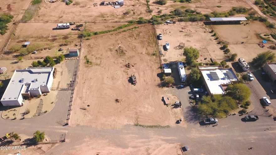 MOTIVATED SELLER! Build your dream home and/or bring your horses to this fantastic 1.21-acre parcel in Wittmann, AZ! Engineering, grading and architectural design has already been completed by the seller possibly saving the buyer time and expense with the building process. This rectangular lot measures approximately 330 ft x 159 ft with road frontage on N 252nd Drive. Horse-friendly w/ nearby open desert and riding trails, this property is ideal for those seeking space, privacy, and a true Arizona lifestyle. Enjoy the convenience of a shared water well, with electric and water connections at the property. NO HOA, and is surrounded by neighboring homes already built. Plenty of room for a custom home, horses, RVs, and toys. Don't miss this excellent opportunity to own usable acreage with u