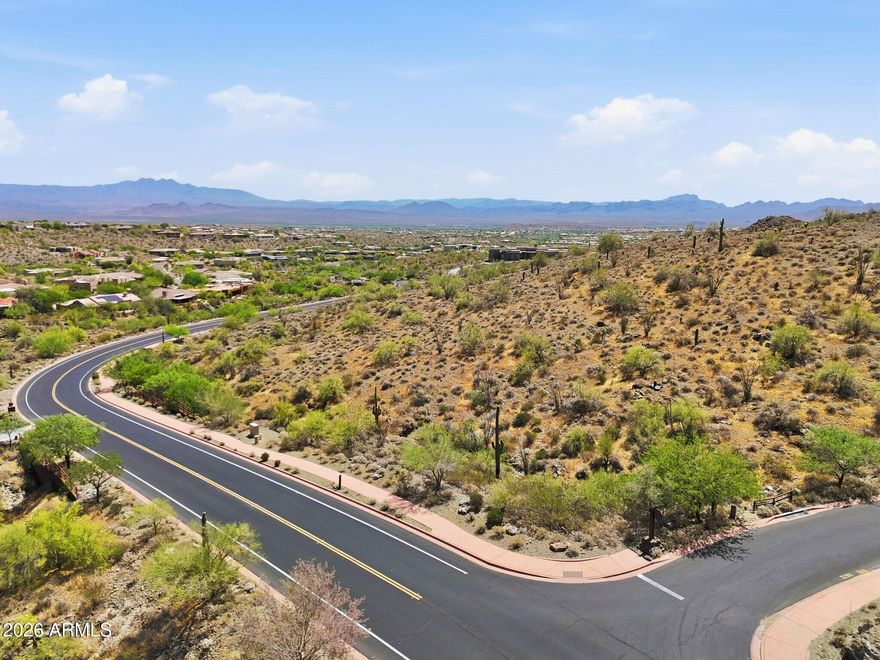 A phenomenal opportunity to create a truly bespoke hillside desert retreat on a premium corner lot offering enhanced privacy, expanded frontage, and elevated positioning within the prestigious, guard-gated Eagles Nest community. This expansive homesite captures breathtaking panoramic views of the surrounding Sonoran Desert, the iconic Four Peaks, and the renowned Fountain Hills Fountain. Set within this exclusive enclave of custom estates, Eagles Nest offers a rare blend of serenity and refinement, yet just minutes from world-class golf, scenic hiking trails, upscale shopping and dining, and the vibrant art and cultural experiences that define Fountain Hills living. This is a rare opportunity to design and build a one-of-a-kind residence in one of Fountain Hills most sought-after luxury communities.
