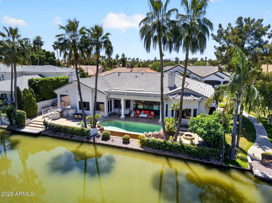 Waterfront BASEMENT home in West Lake Estates. This is a combination almost impossible to find in Gilbert. 5,731 sqft, 6 bed, 4.5 bath, private dock and direct lake access. The lot is exceptional, the floor plan is rare, and the lifestyle is real. Bring your vision. Main level: soaring ceilings, open great room, granite kitchen, double-door den (or 6th bed), and a primary suite with lake views, fireplace, and spa ensuite. The backyard delivers: negative-edge pool & spa, built-in BBQ, sunken fireplace, outdoor shower, and a private dock for kayaking or paddleboarding at sunrise. Basement: fully finished with a complete second kitchen, 2 bedrooms, full bath, fireplace, and its own private entrance, purpose-built for multi-generational living, guests, or serious rental potential. A built-in dumbwaiter connects both levels. Val Vista Lakes amenities include a clubhouse, sandy beach lagoon, tennis, pickleball, fitness center, heated Olympic pool, and waterfront trails. One of the most coveted communities in the East Valley and this is one of its rarest homes. Investor, remodeler, or lifestyle buyer the bones, the lot, and the lake are all here. This is the ONE!