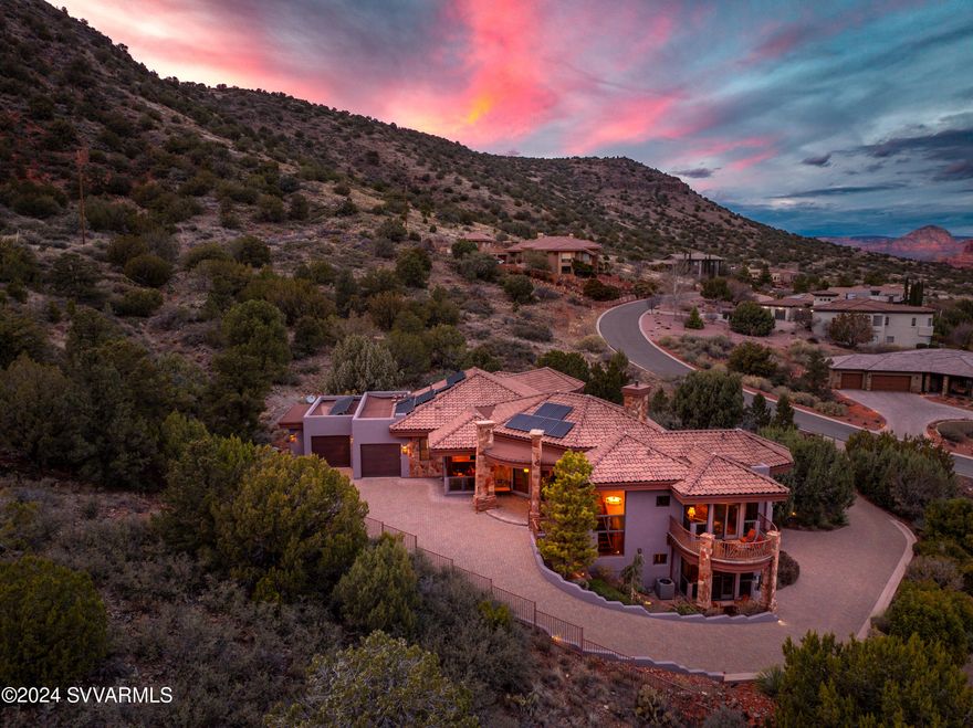 Unparallelled luxury spa-like estate backing to National Forest with expansive Red Rock views of the surrounding buttes and mesas. This Sedona Golf Resort private residence is perched for unblockable red rock views from every room and endless outdoor entertainment - Pebble-Tek pool on one side and miles of slickrock trails out back. Massive bedroom suite features butted glass windows to maximize views. Bespoke kitchen with stainless Thermidor/Wolf appliances and living room with disappearing radius glass doors make this home ideal for entertaining guests.  Lower level elevator accessible suites with kitchenette provide an ideal guest experience that opens onto the dreamlike Sedona backyard pool for lounging in the shadows of the red rocks. Buyer to get a 3 year golf membership at closing. *Can be made available with full furniture package for a complete move-in ready luxury Sedona getaway.