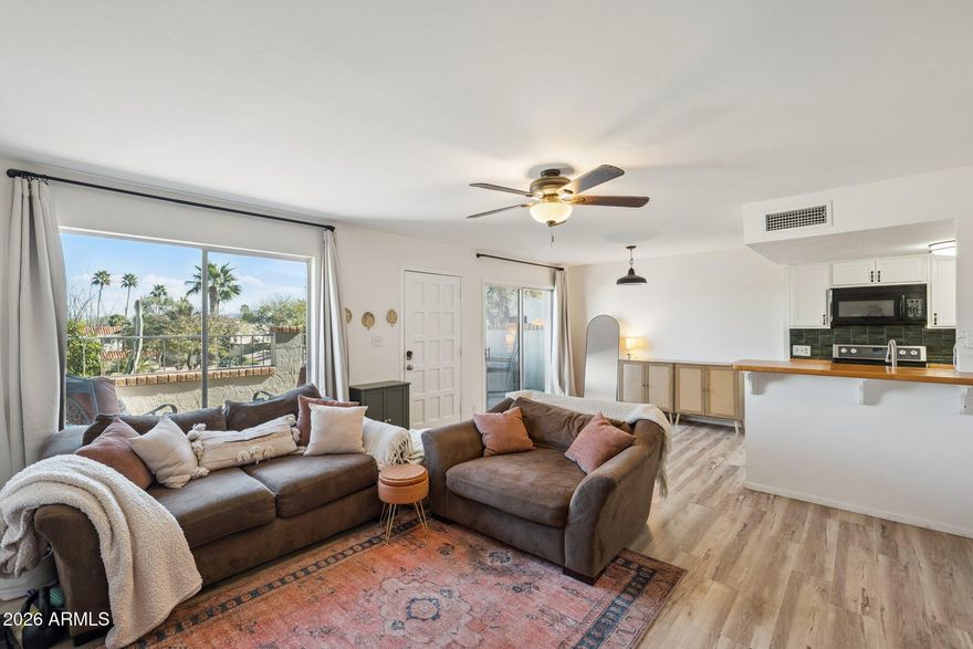 Welcome to this charming townhome in the heart of Fountain Hills. Step inside to an open and inviting floor plan with plenty of space to relax. The home features updated flooring, a beautifully appointed kitchen, and  views of the surrounding natural landscape. Located just over a mile from Fountain Park, local shops, and dining, you'll enjoy both convenience and a peaceful setting. The community offers a pool, easy laundry access, and low-maintenance living. Whether you're looking for a full-time residence, a lock-and-leave retreat, or a fantastic Airbnb opportunity, this home checks all the boxes.